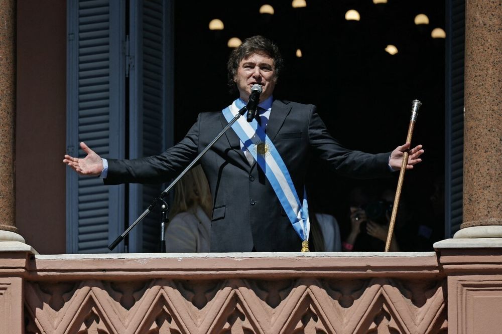 Argentina's new president Javier Milei speaks to the crowd from a balcony of the Casa Rosada presidential palace during his inauguration day in Buenos Aires, Argentina.